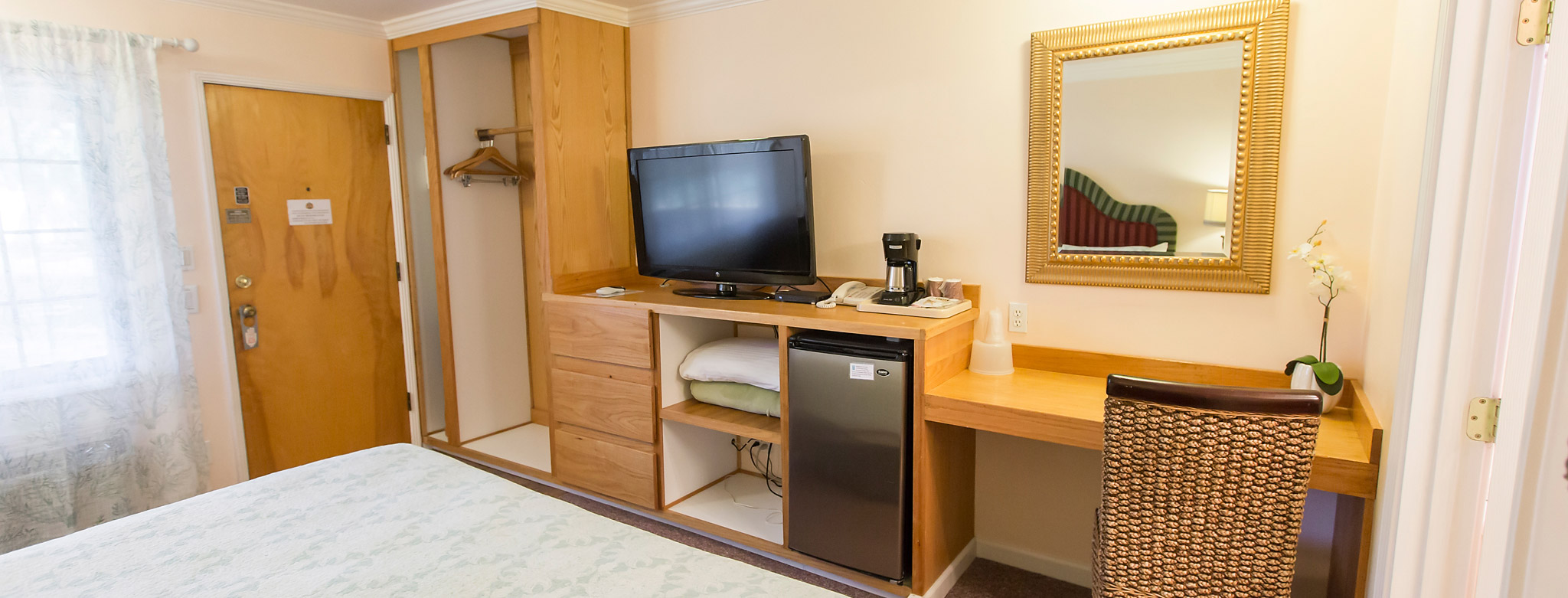 Bright and clean rooms with mini fridge, wardrobe, vanity, coffee maker and more.