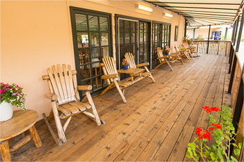 Giant porch with sitting chairs for socializing and relaxing.