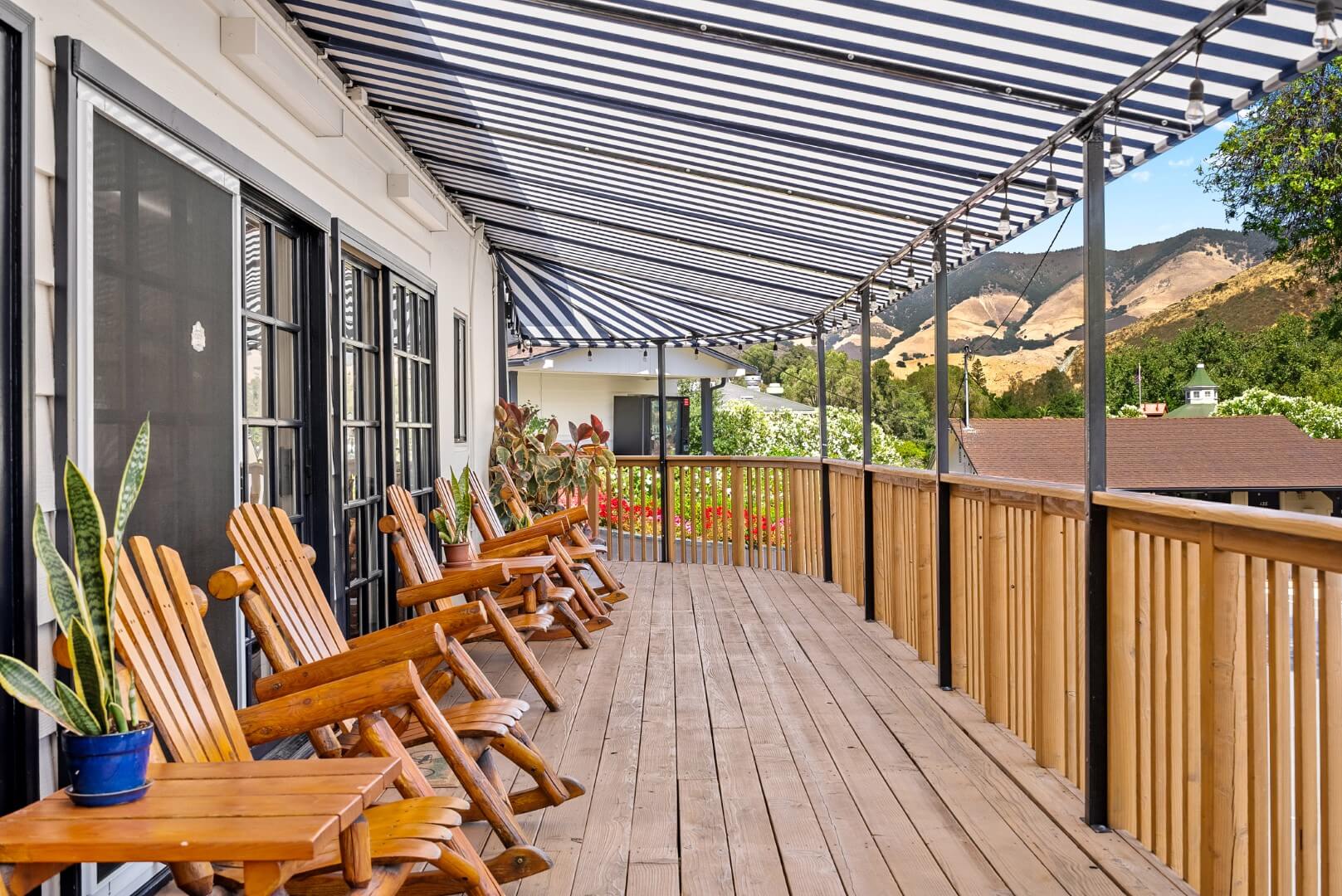 Giant porch with sitting chairs for socializing and relaxing.